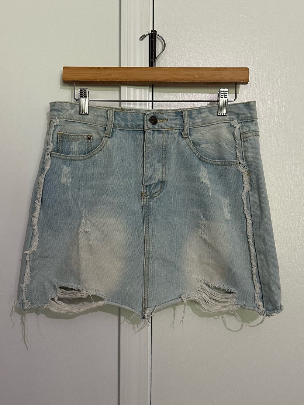 Light wash distressed denim skirt